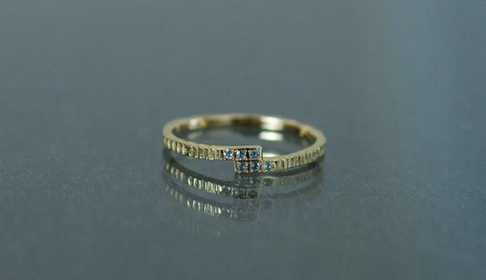 Unknown knowns line ring + blue topaz