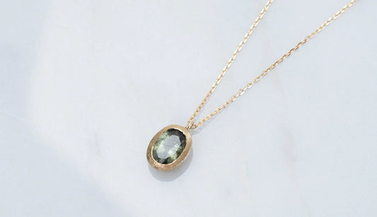 Ludwigite in peridot necklace