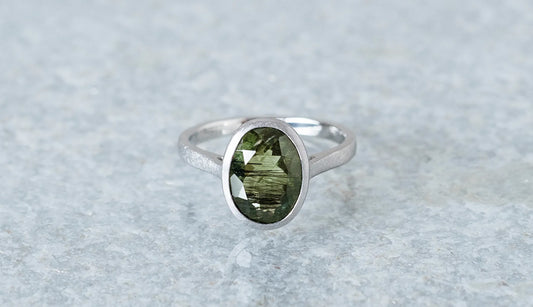 Ludwigite in peridot ring