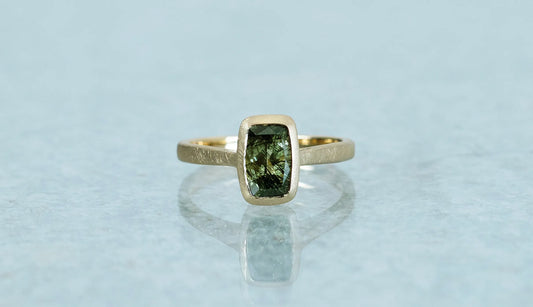 Ludwigite in peridot ring